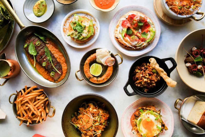Various Indian dishes styled on a marble table