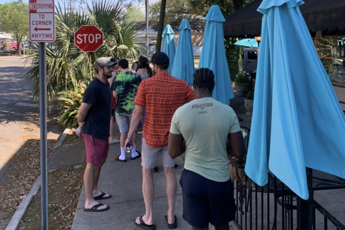 People waiting in line for food