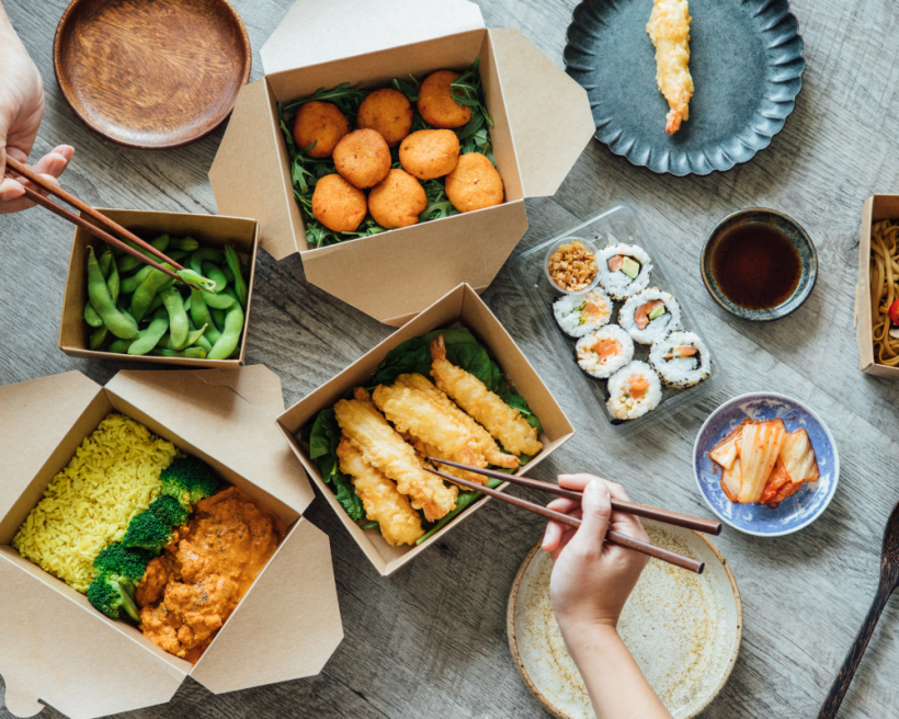 Sushi in takeout boxes