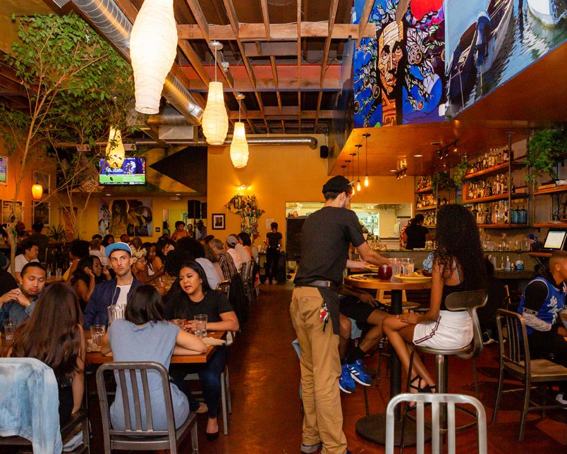 A busy restaurant full of people