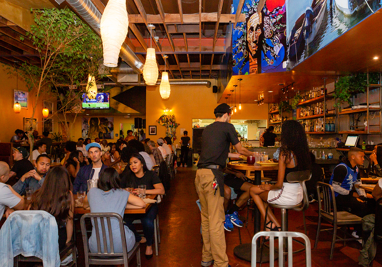 A busy restaurant full of people