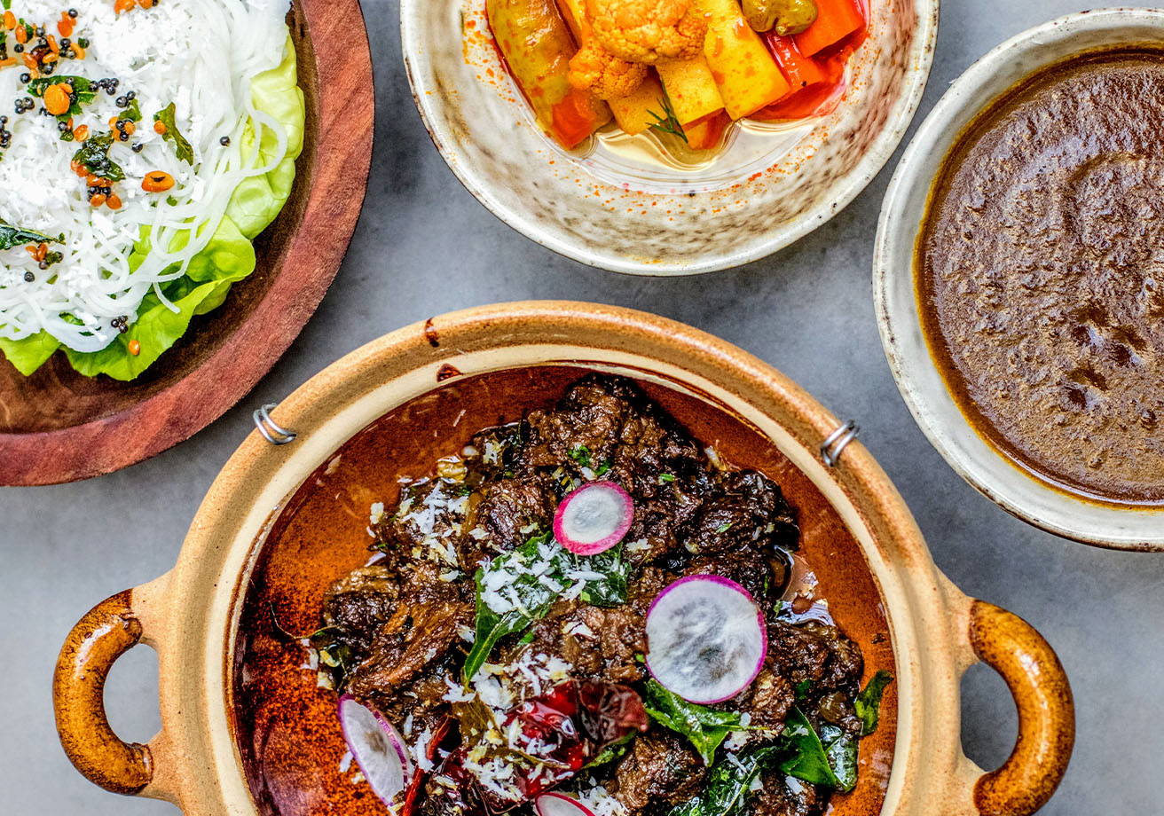 An assortment of Indian dishes in bowls.
