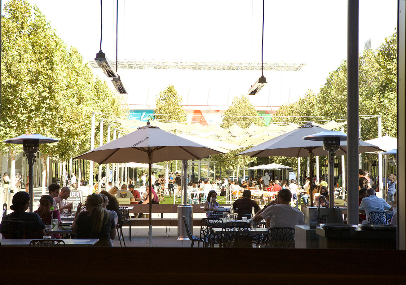 An outdoor patio with people dining.