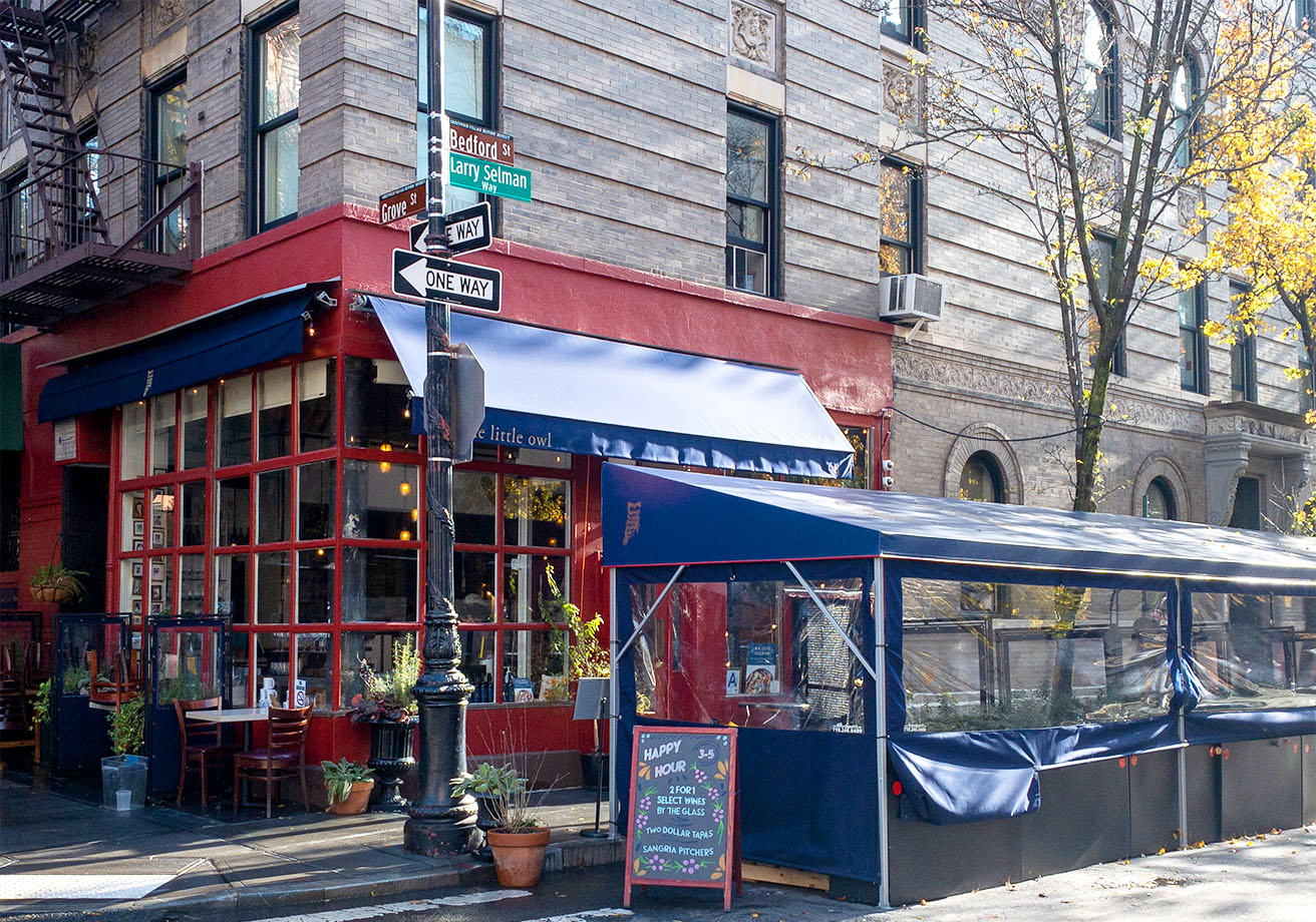 A tented patio area outside of a restaurant.
