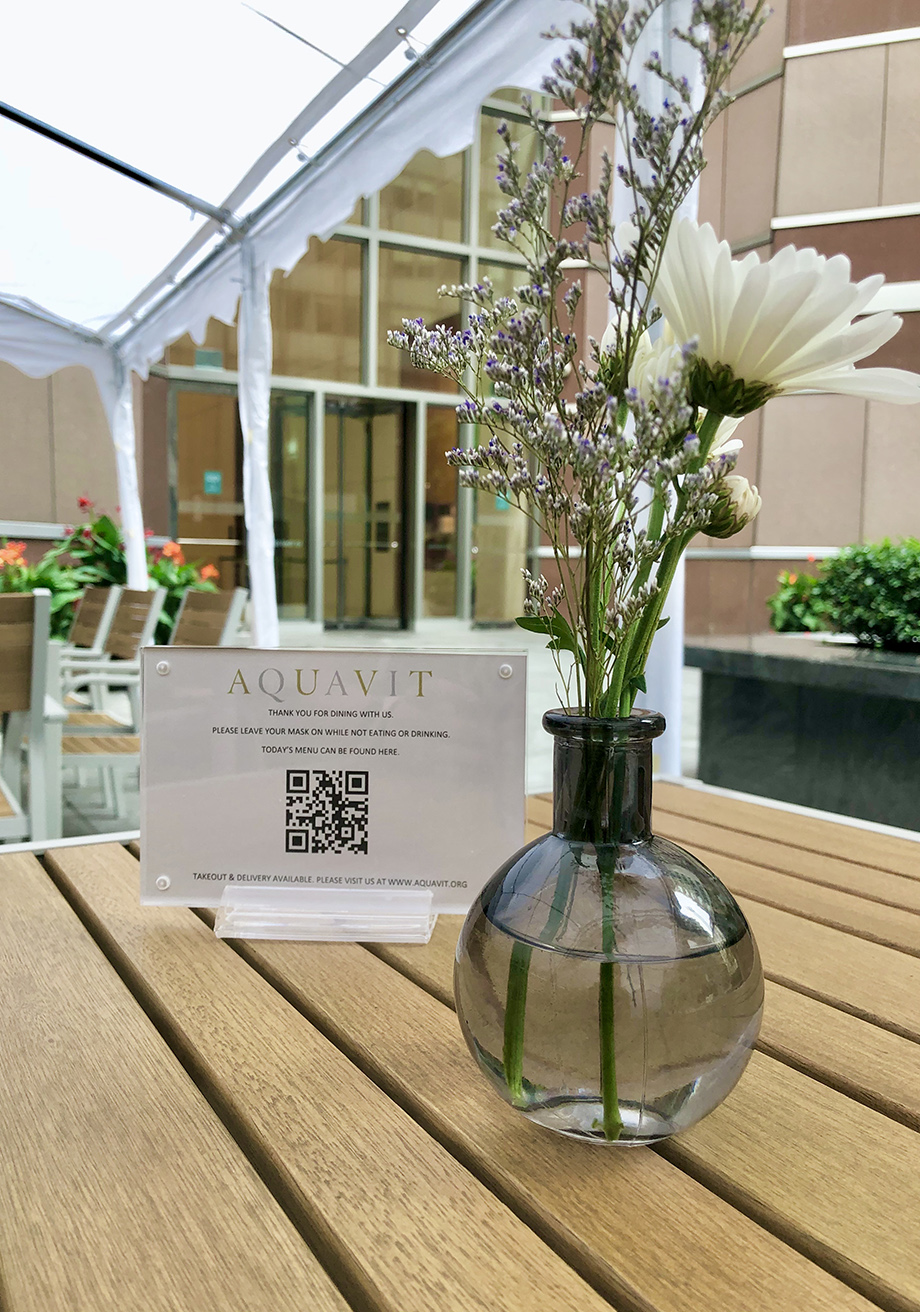 Flowers and a card on a wooden table