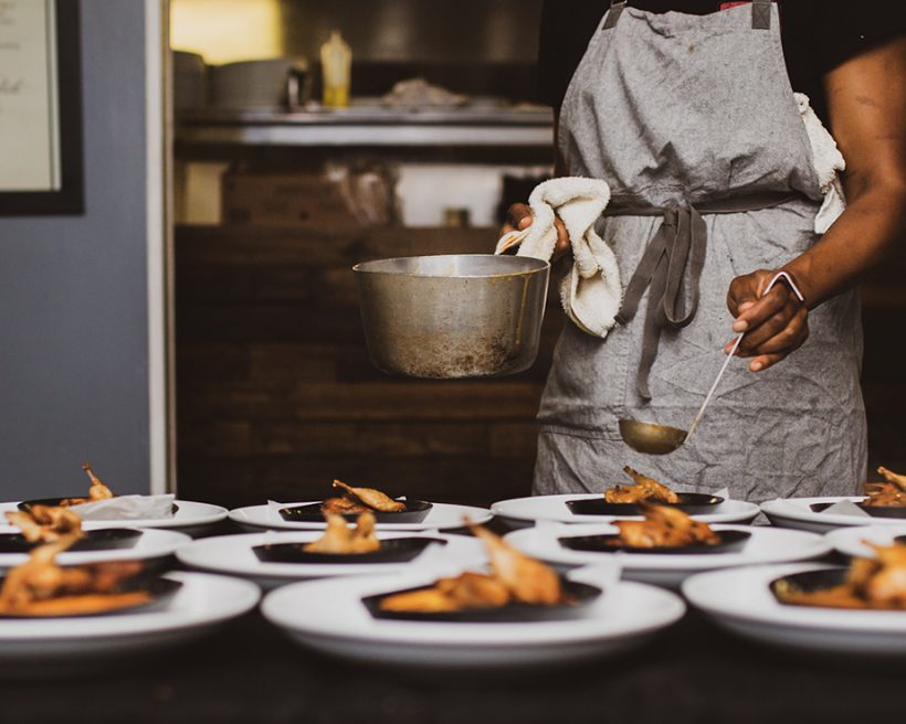 A Black chef preparing food