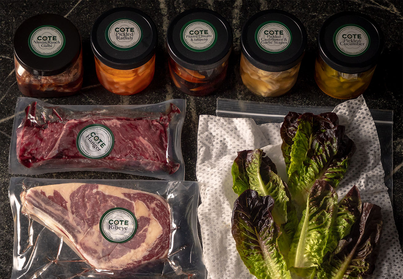 A spread of meat and sides from Cote's meal kit