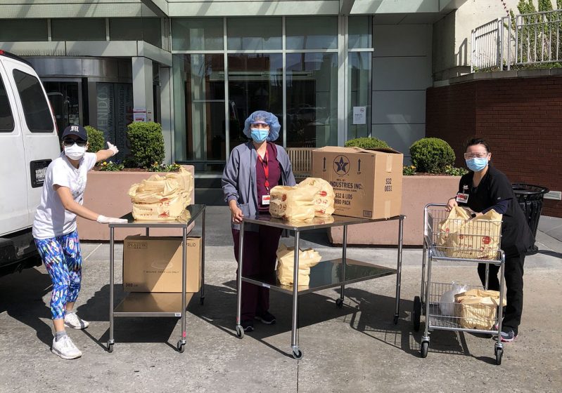 Sakura Yagi serving meals to hospital workers