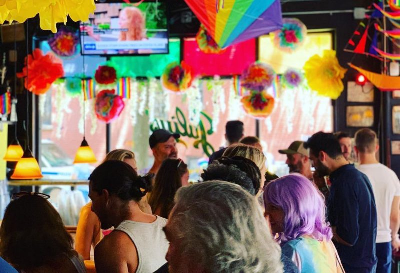 A crowd of patrons in a bar.