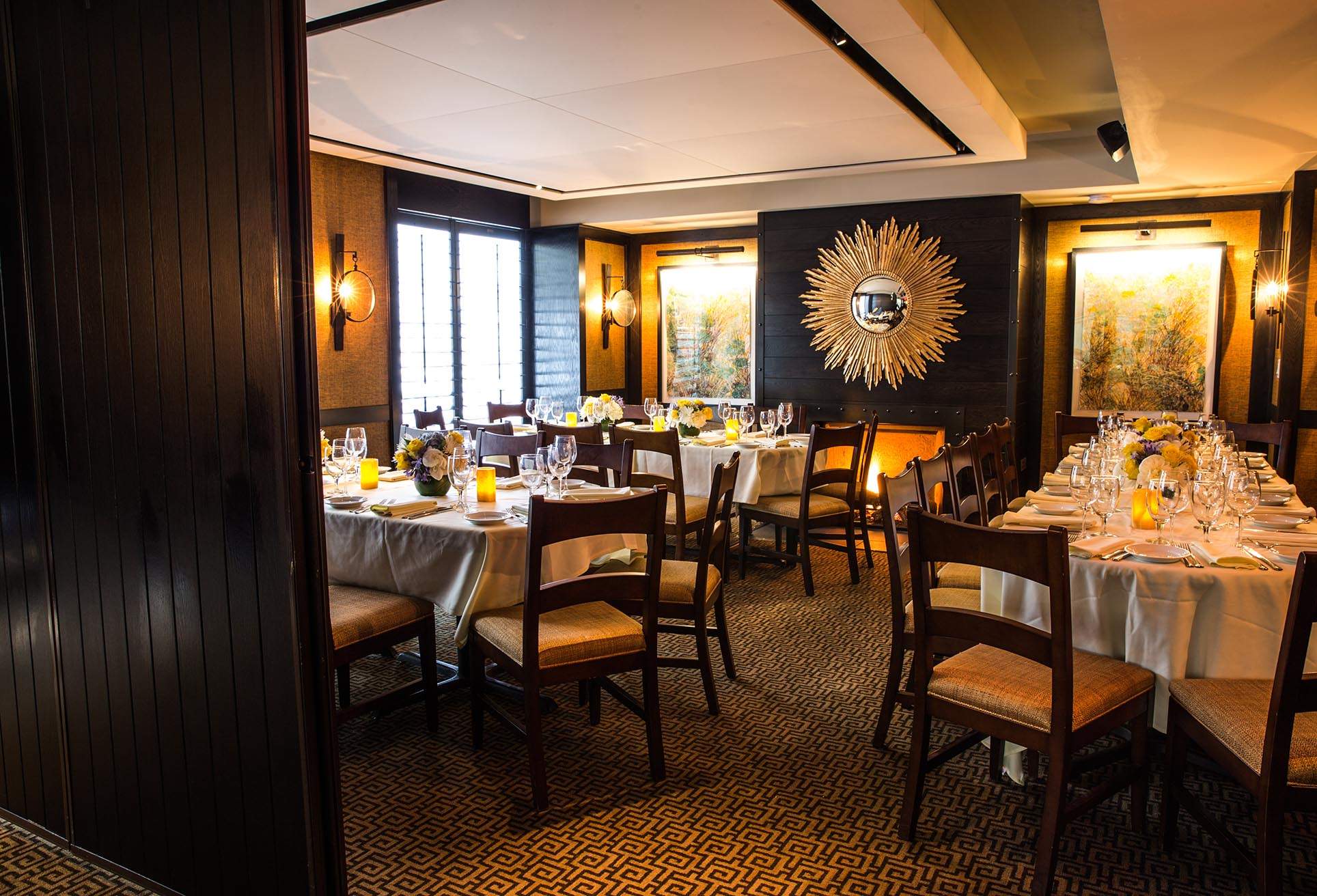 A sunburst sculpture and fireplace at Harvest in Boston