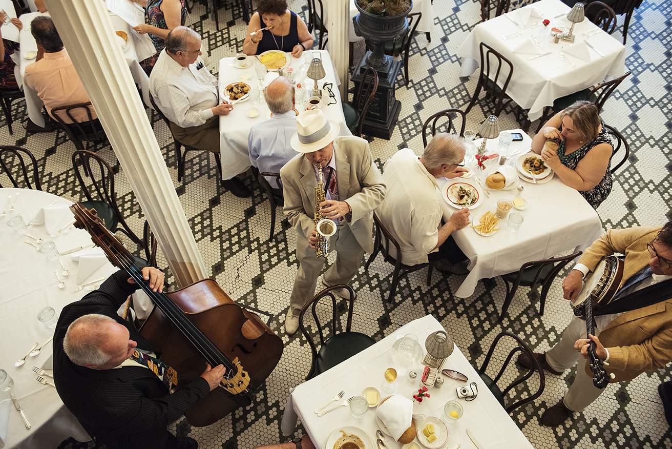 A saxophonist and bass player perform at Arnaud’s jazz brunch in New Orleans