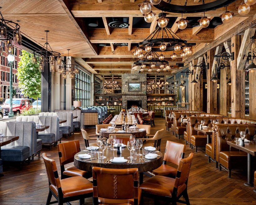 Leather seats and brass accents in the dining room at Water Grill in Denver