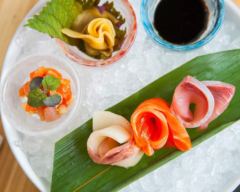 Sashimi on ice arranged in floral patterns at Kumiko in Chicago's West Loop neighborhood.