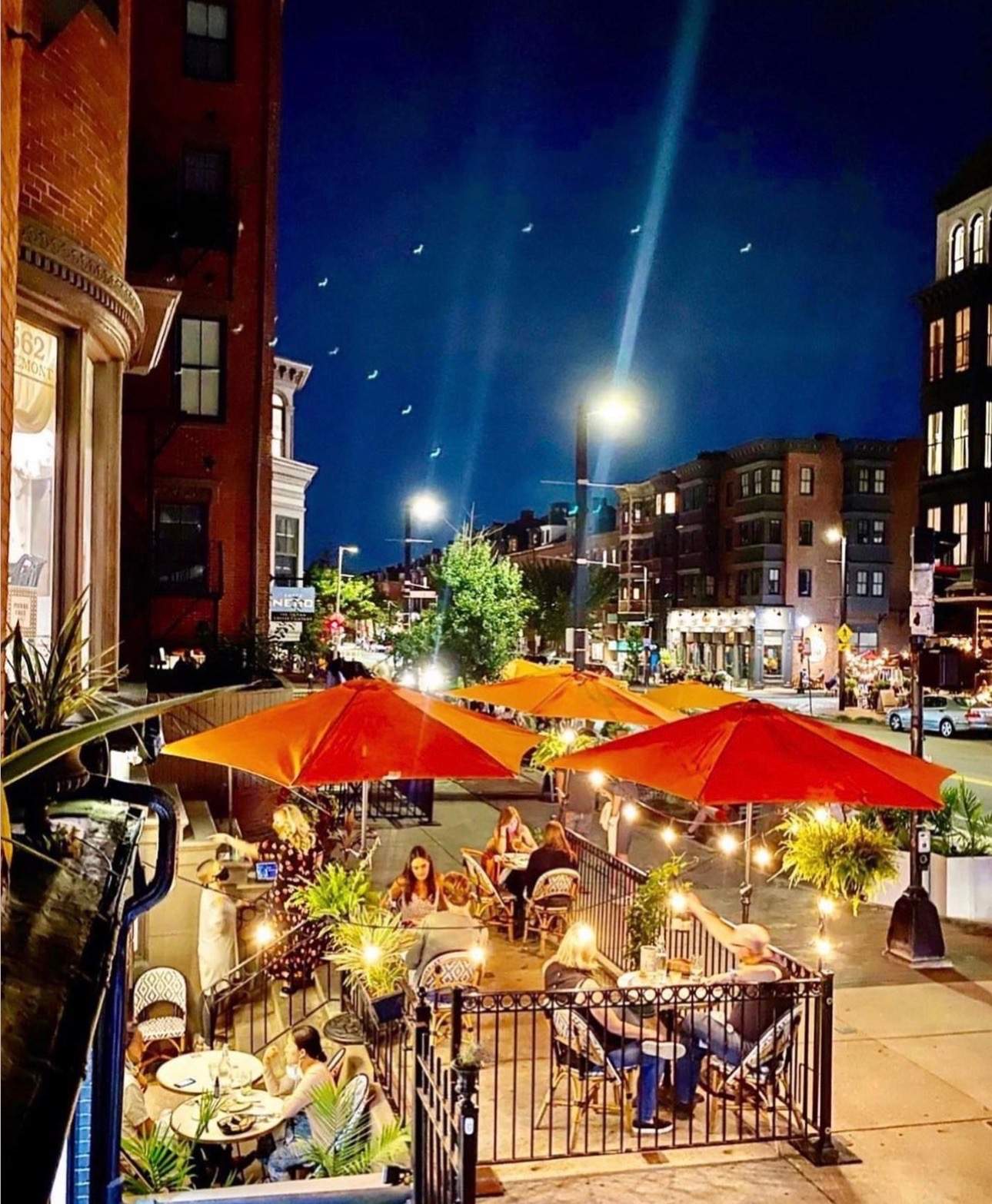 Orange umbrellas deck the outdoor seating area at Frenchie in the South End.