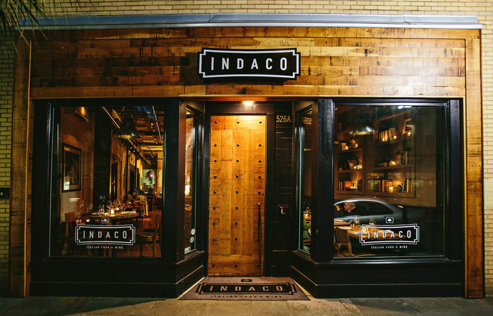 The wooden entrance to Indaco in downtown Charleston