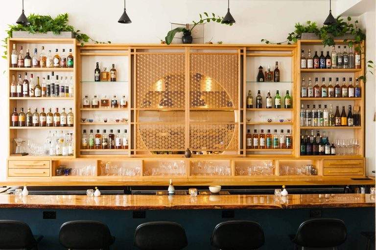 The pale custom woodwork bar Kumiko, a Japanese bar in Chicago's West Loop neighborhood.