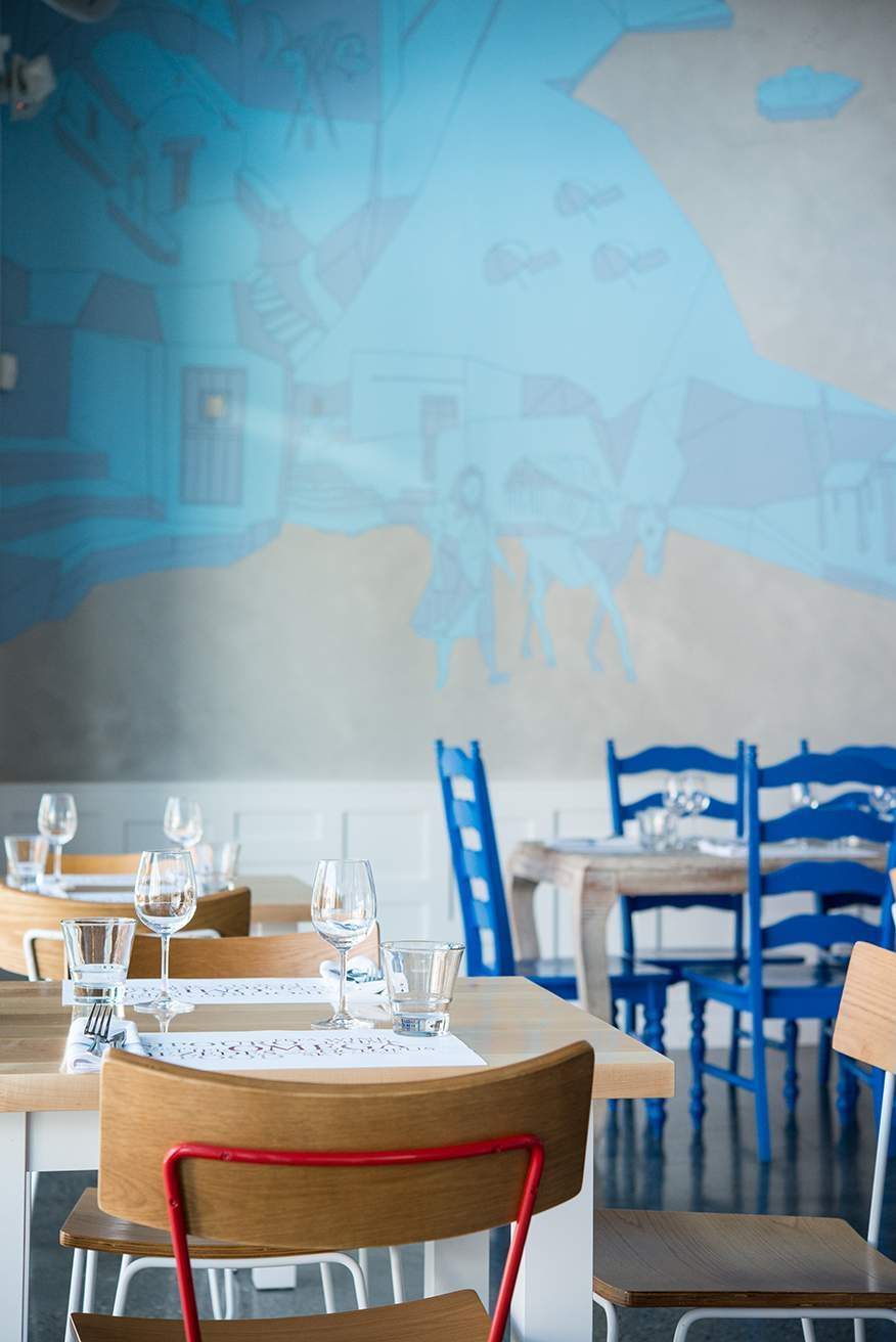 Greek island scenes adorn the walls at Omega Ouzeri in Pike/Pine