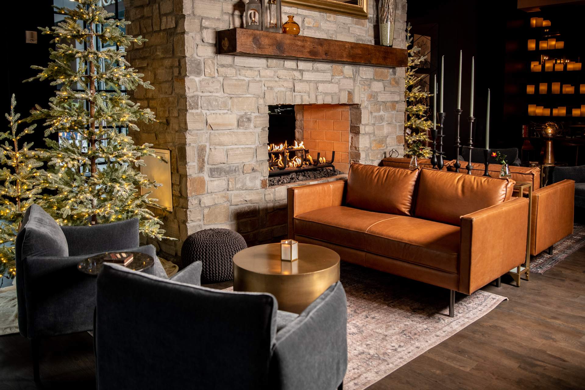 A fireplace and seating area at Saints + Council in Midtown