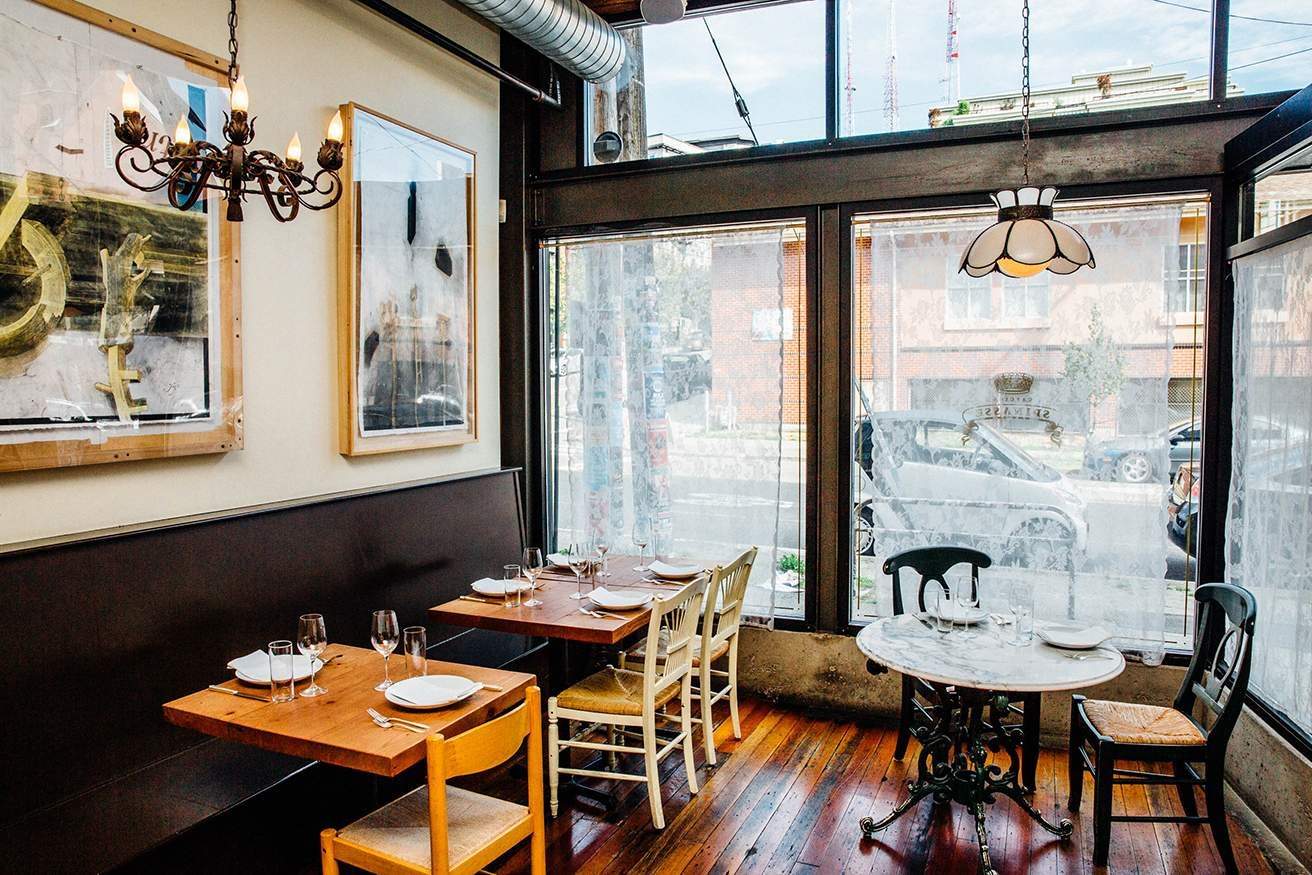 Lace curtains line the large windows at Spinasse in Capitol Hill