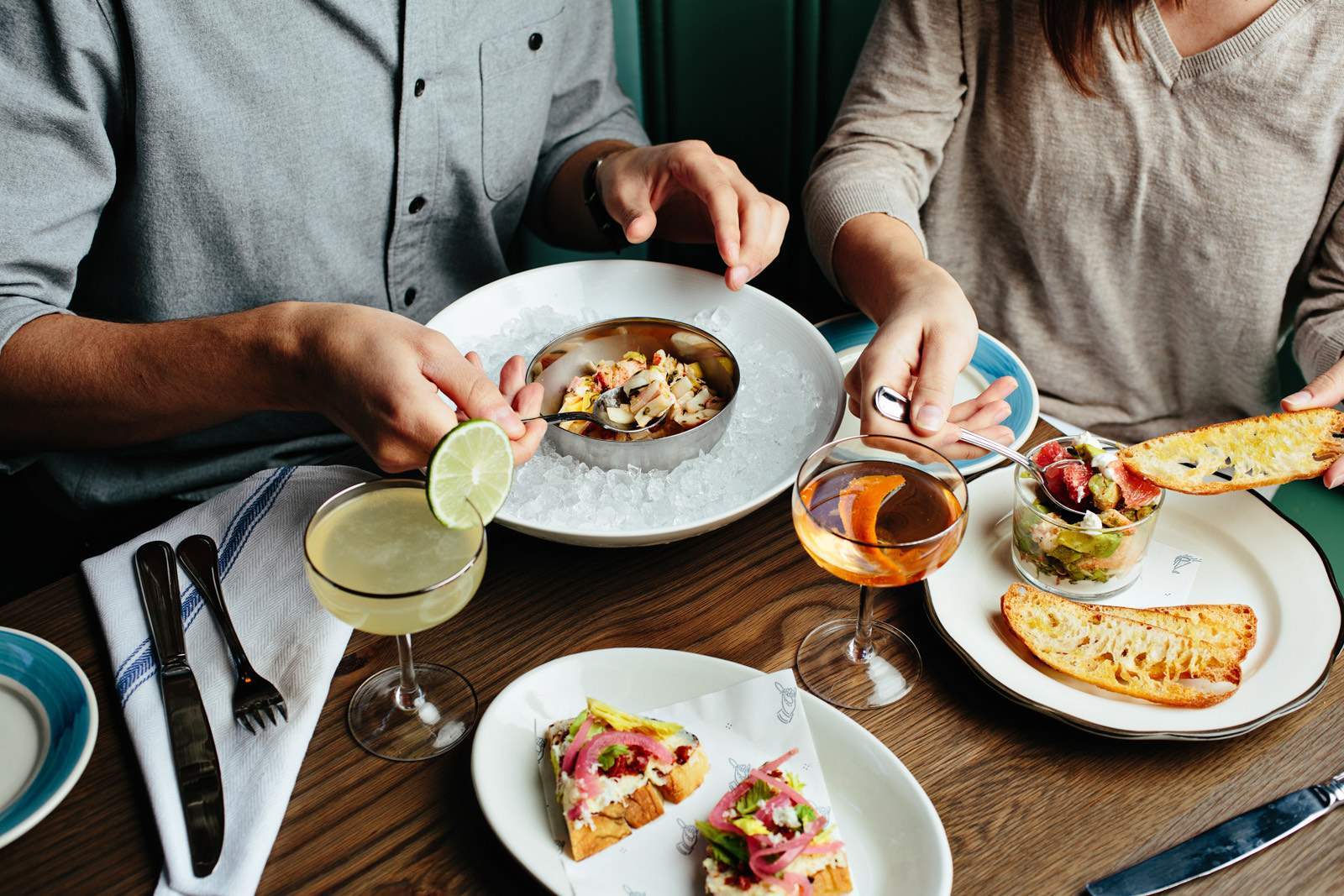 Cocktails and seafood appetizers at The Darling Oyster Bar in downtown Charleston