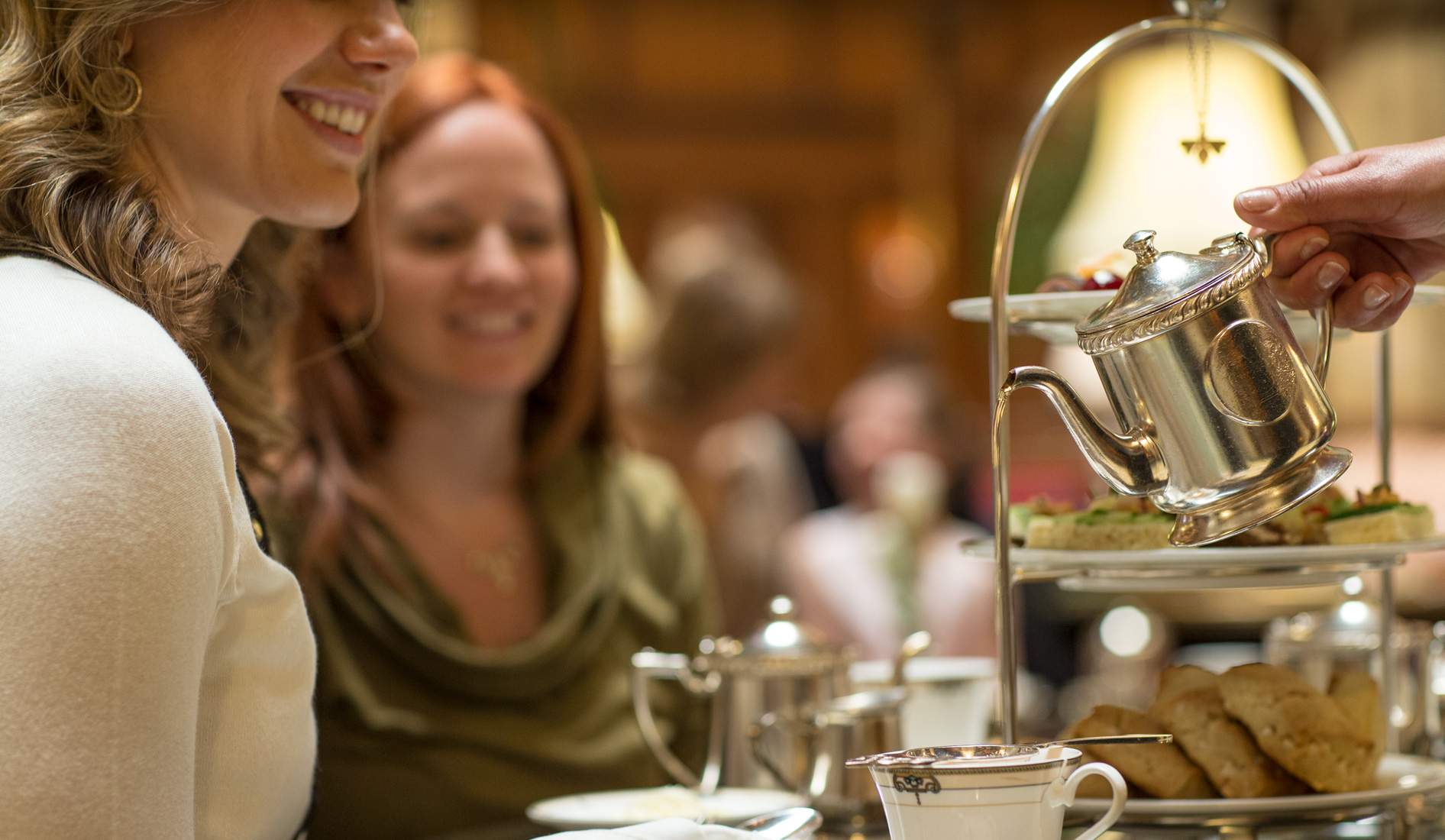 Tea being poured from a silver kettle at the Brown Palace Hotel in Denver