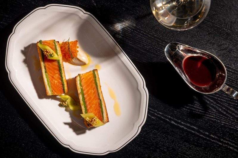 Salmon en croute with pickled cucumber, sunchoke, and beetroot-beurre rouge at Koloman in New York City