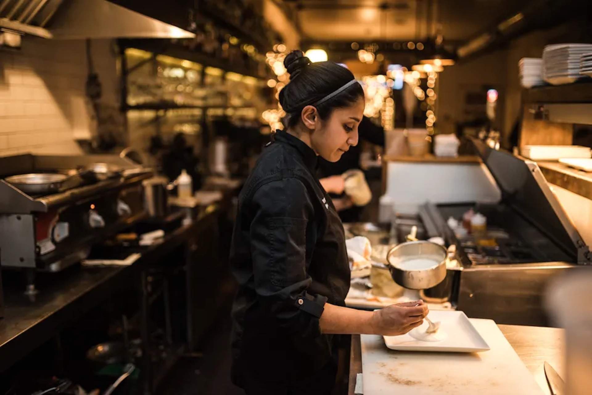 The chef Cindhura Reddy preparing a dish at her restaurant