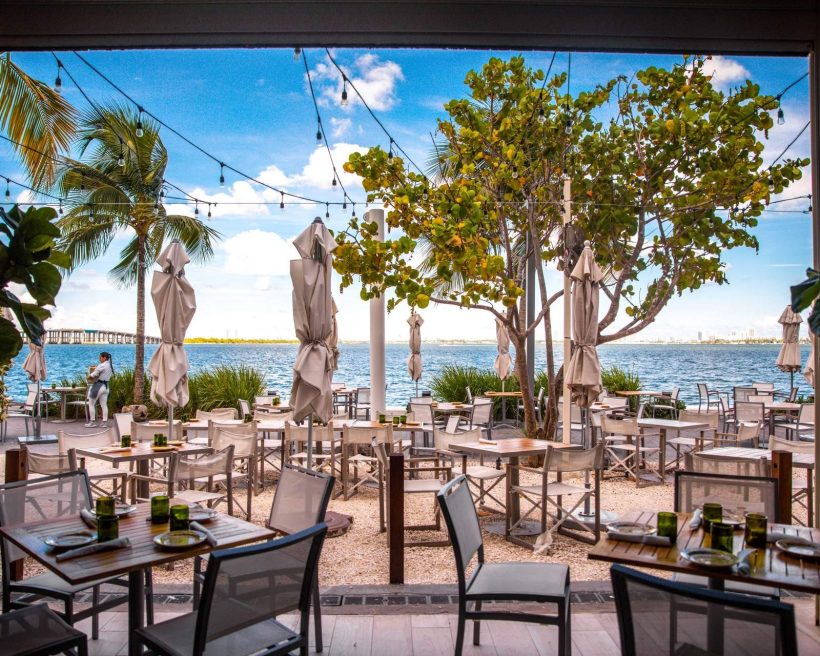 The outdoor dining seats at Amara at Paraiso in Miami look out onto Biscayne Bay