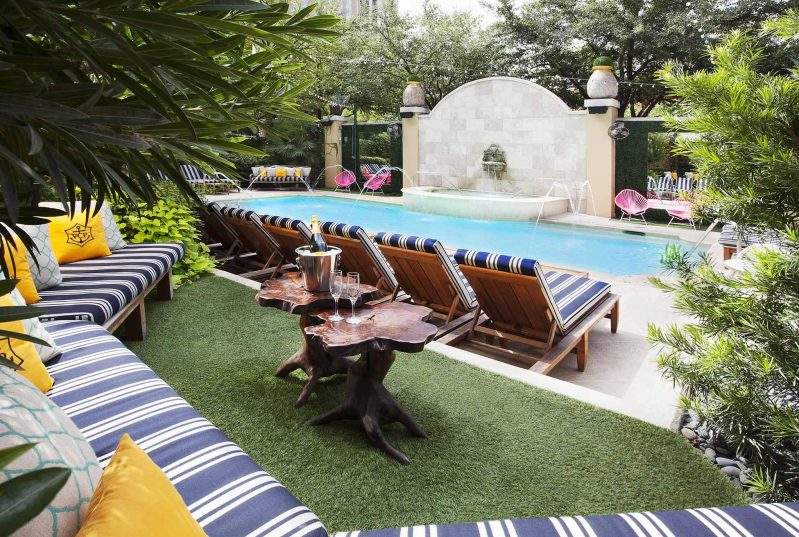 Pool and fountain-facing seats make up the outdoor dining area at Dragonfly at Hotel ZaZa in Dallas