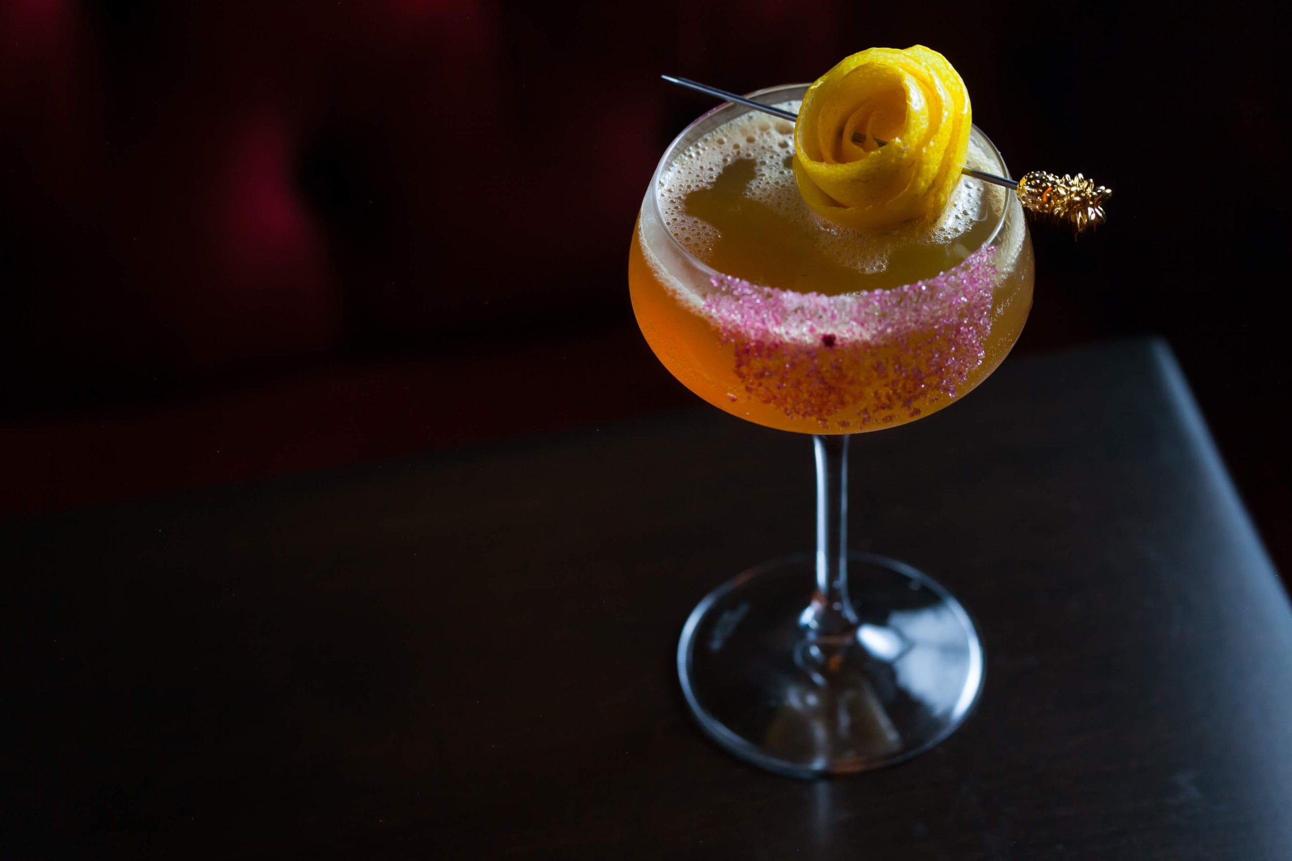 A rose-shaped lemon peel accents a sidecar cocktail at the Alderman in Chicago.