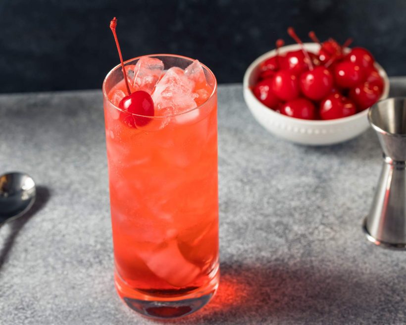 A pink drink with a cherry that's called a dirty shirley