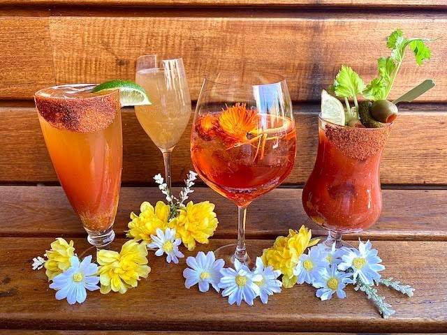 Four red-colored cocktails at Henley in Nashville