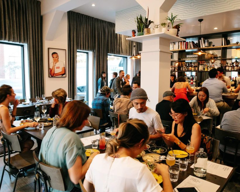 A group of diners eating inside LA's Here's Looking At You
