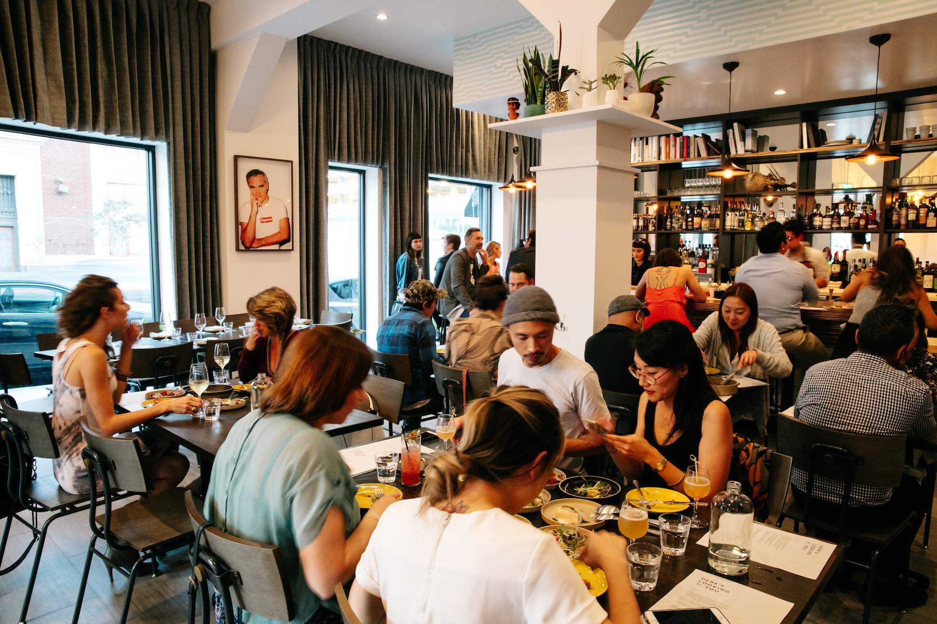 A group of diners eating inside LA's Here's Looking At You