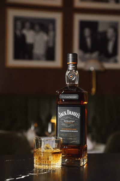 A bottle of Jack Daniel’s Sinatra Century bourbon alongside a glass of bourbon at Sinatra Bar and Lounge in Nashville