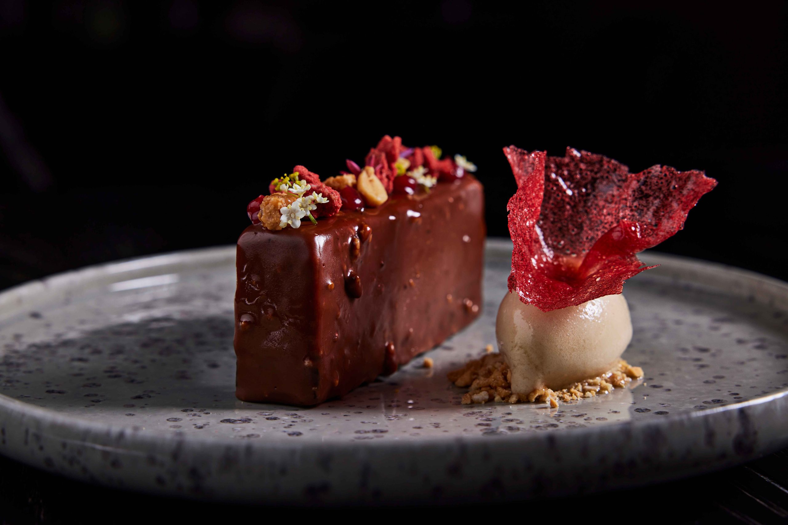 A peanut butter candy bar and a scoop of ice cream at Stubborn Seed in Miami
