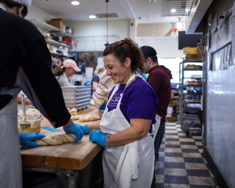 a woman preparing food at Soul Cafe in Michigan