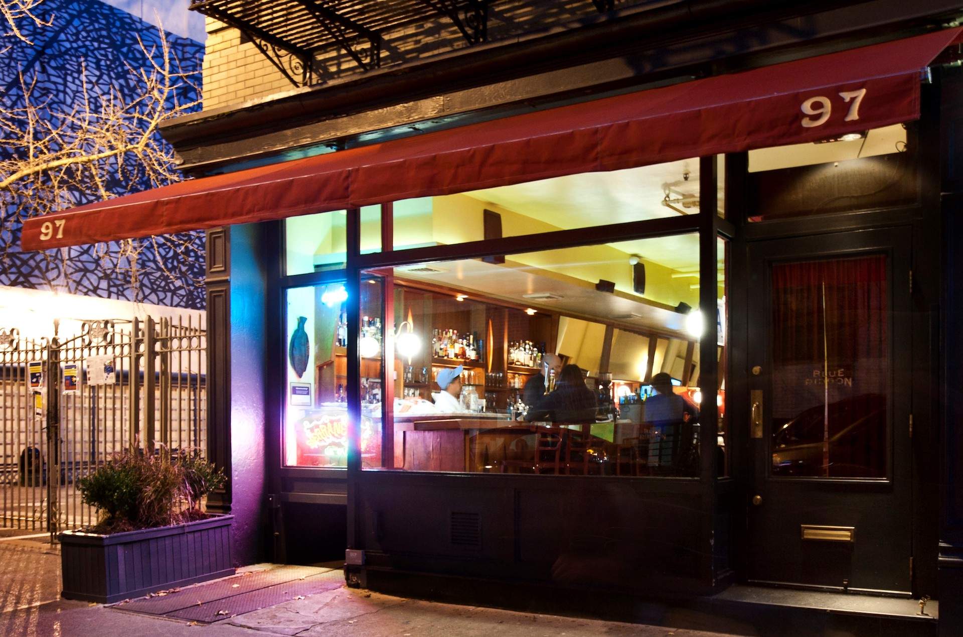 The exterior of the Soho restaurant Blue Ribbon Brasserie, which has a red awning