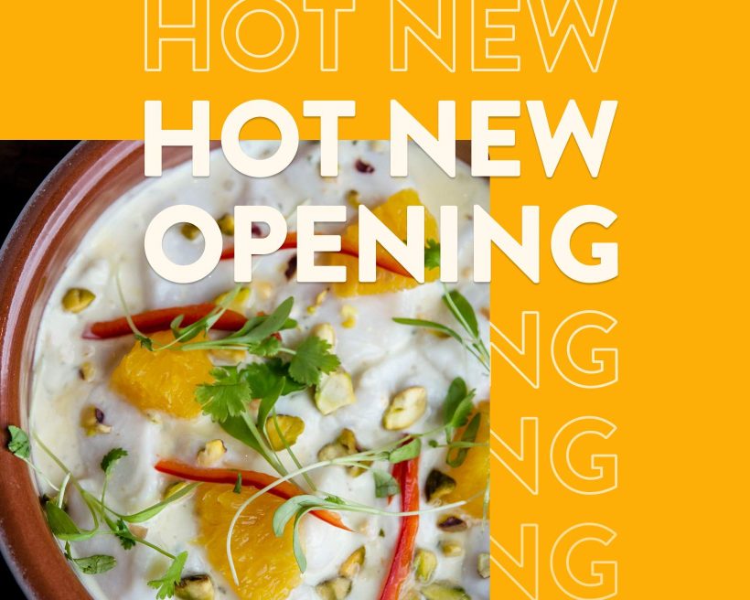 An image of a soup with a yellow border around it that says hot new opening. The dish is from the Boston restaurant Pescador.