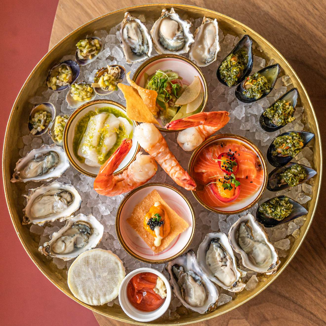 A plate of seafood in a round plate