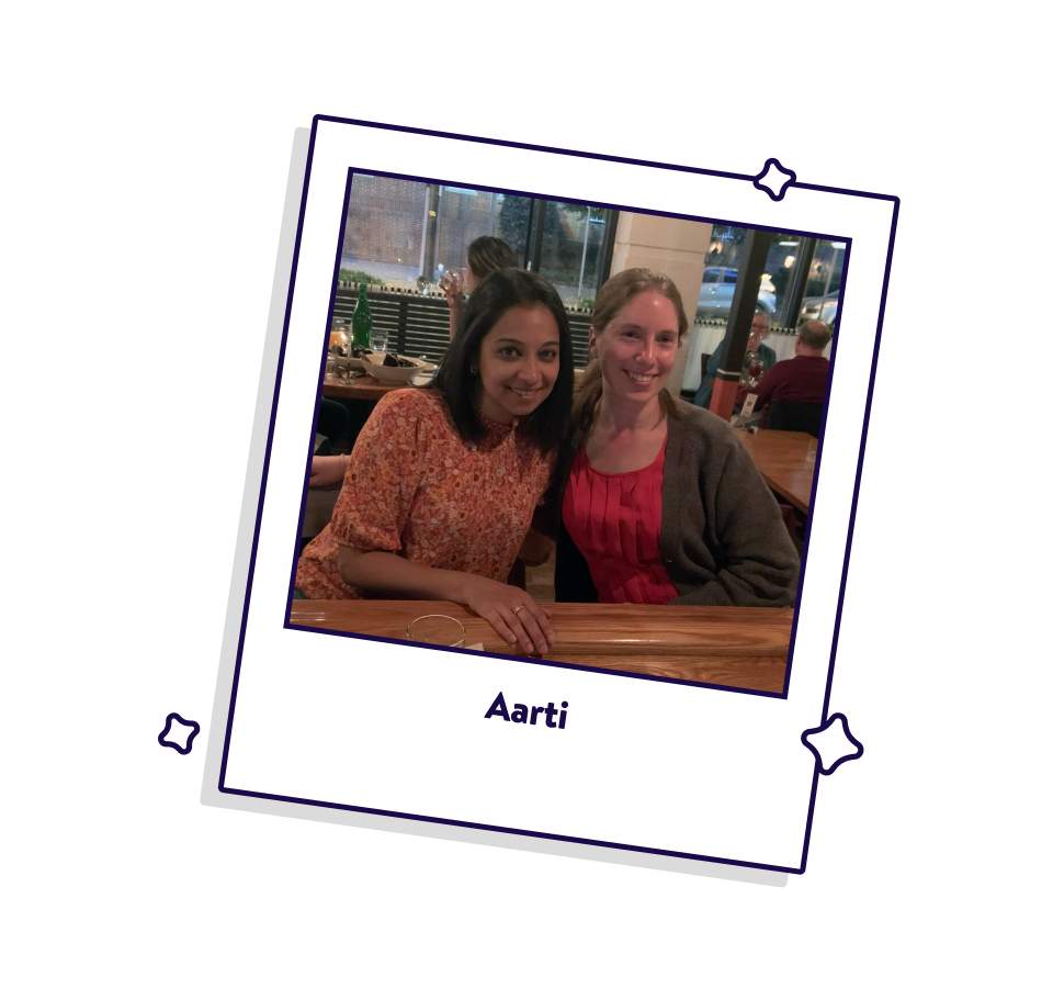 OpenTable blog editor Aarti Virani sitting with a friend at a restaurant