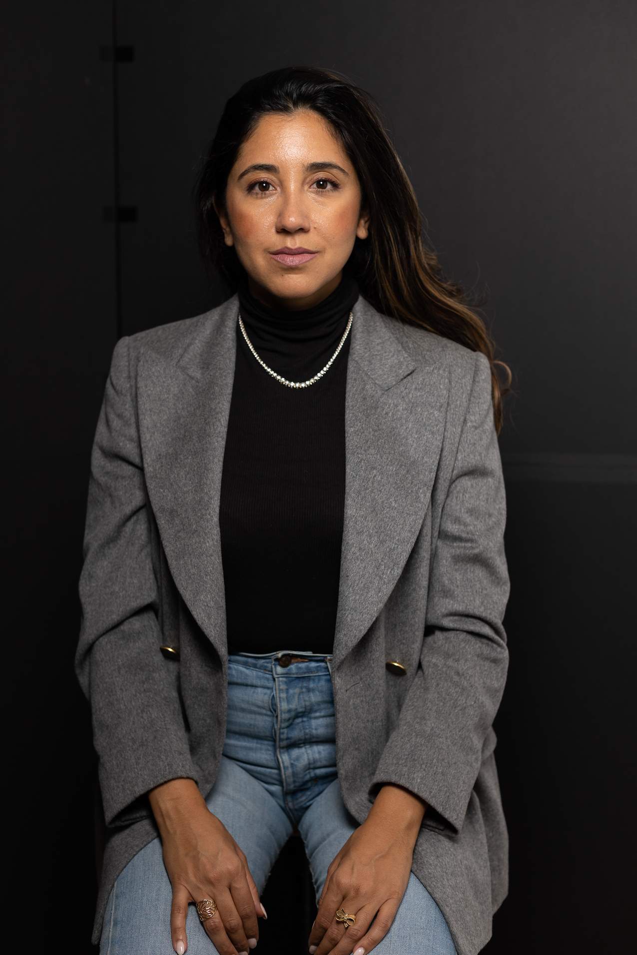 Cook for Iran co-founder Layla Yarjani, seen here wearing a gray coat