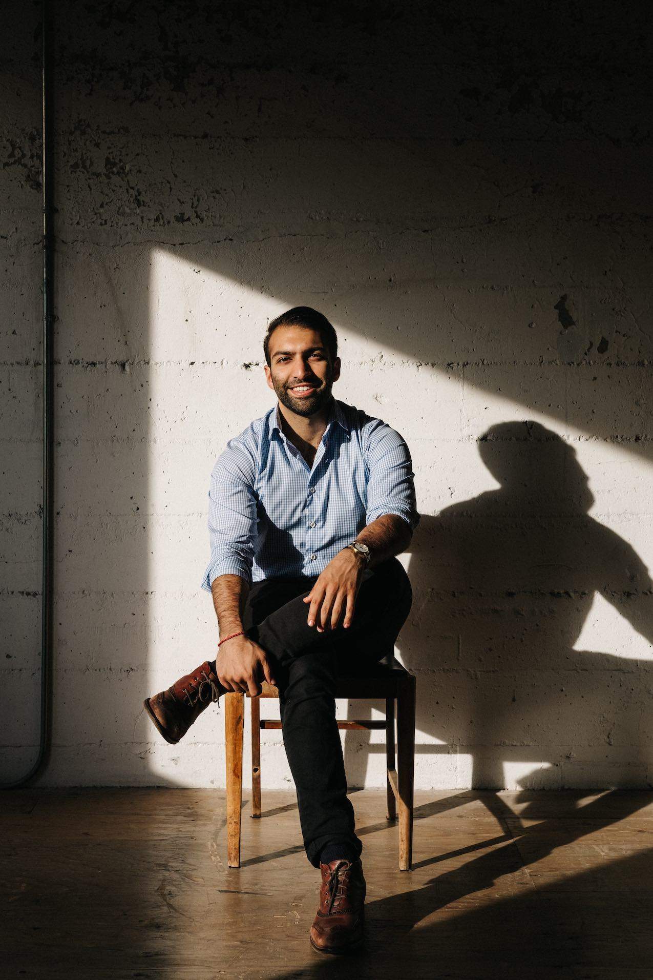 Cook for Iran co-founder Omid Scheybani seen here in a striped white shirt and black pants