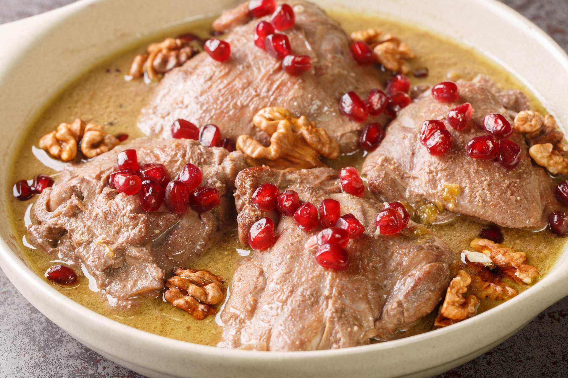 A creamy, reddish-orange Iranian meat stew called Fesenjan.