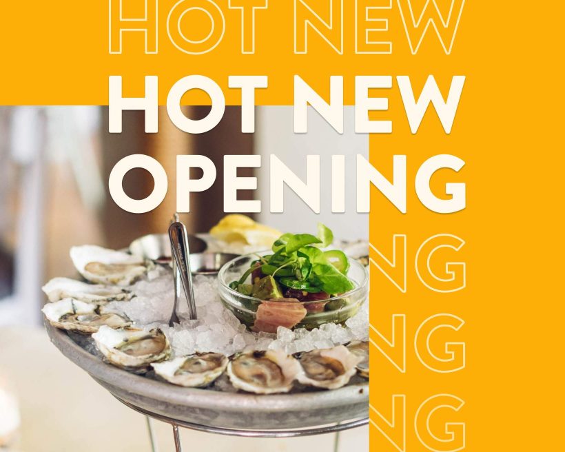 A platter of oysters set amid a yellow background that says hot new opening. This is a photo from The Mermaid Inn's Times Square location