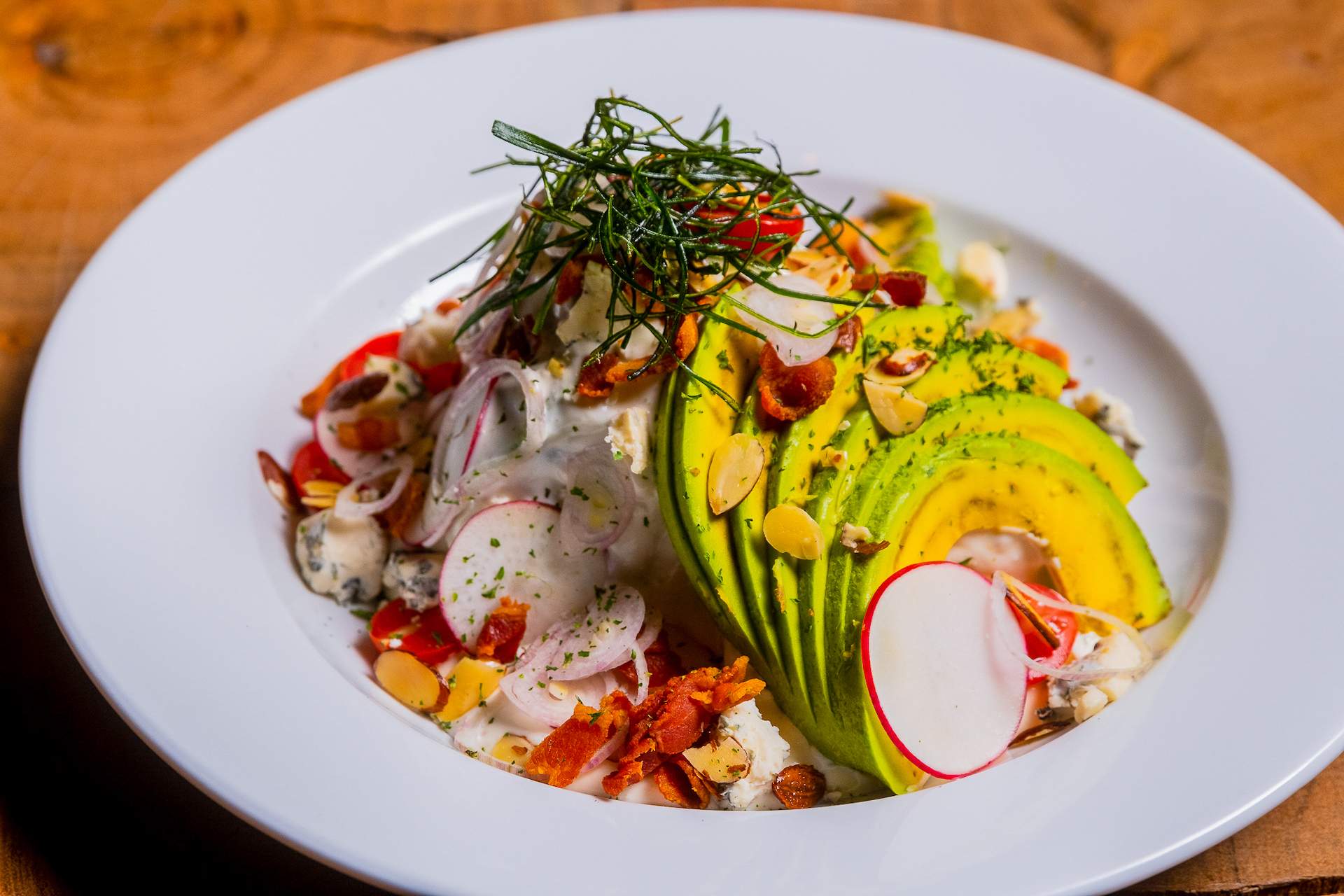 A salad dish at the NYC restaurant Bamboo Walk featuring radish and avocado