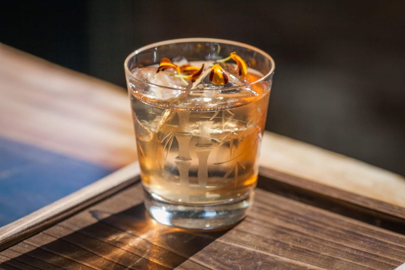 A drink garnished with flower petals