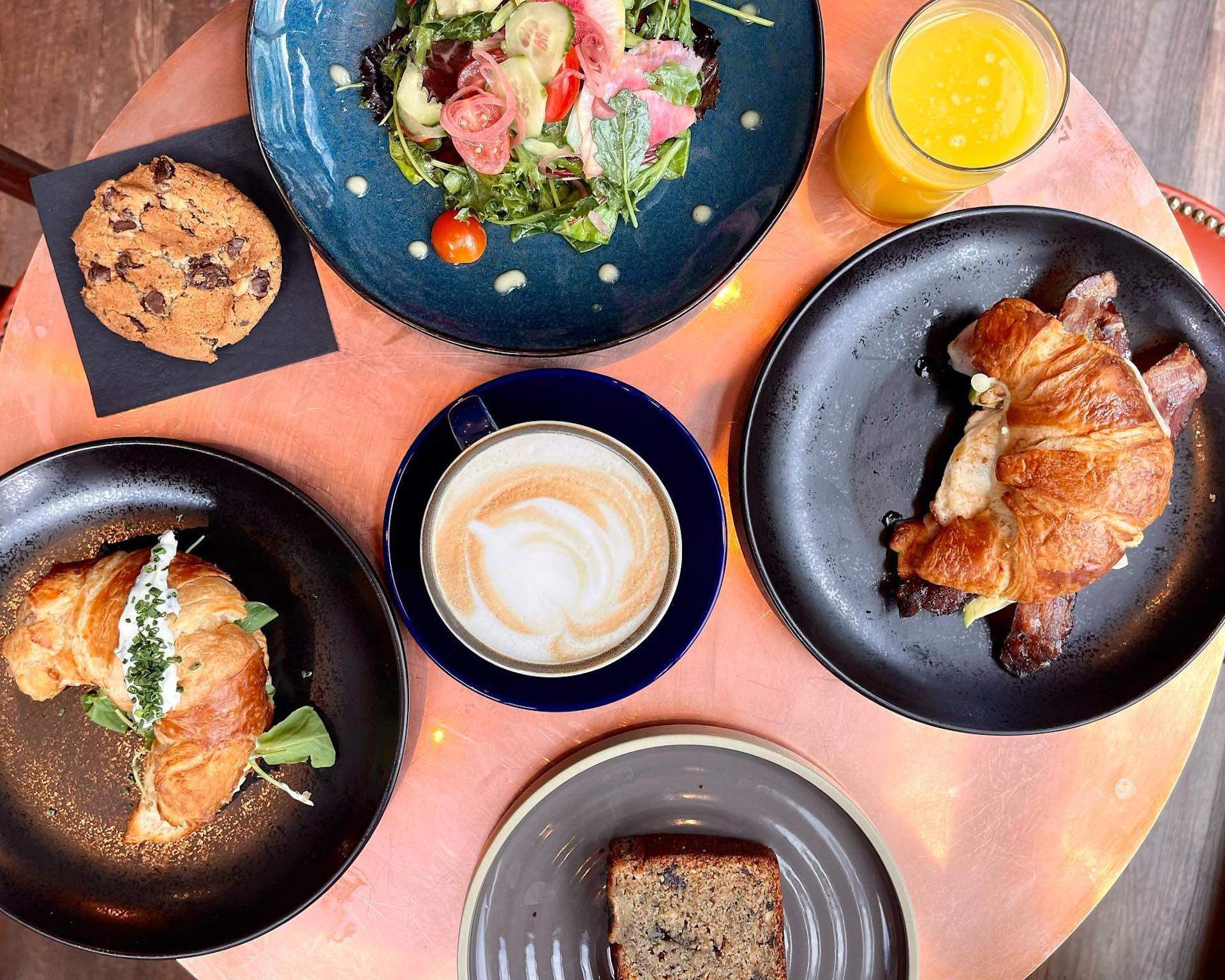 Several breakfast dishes including croissant sandwiches at Cambridge restaurant Batifol