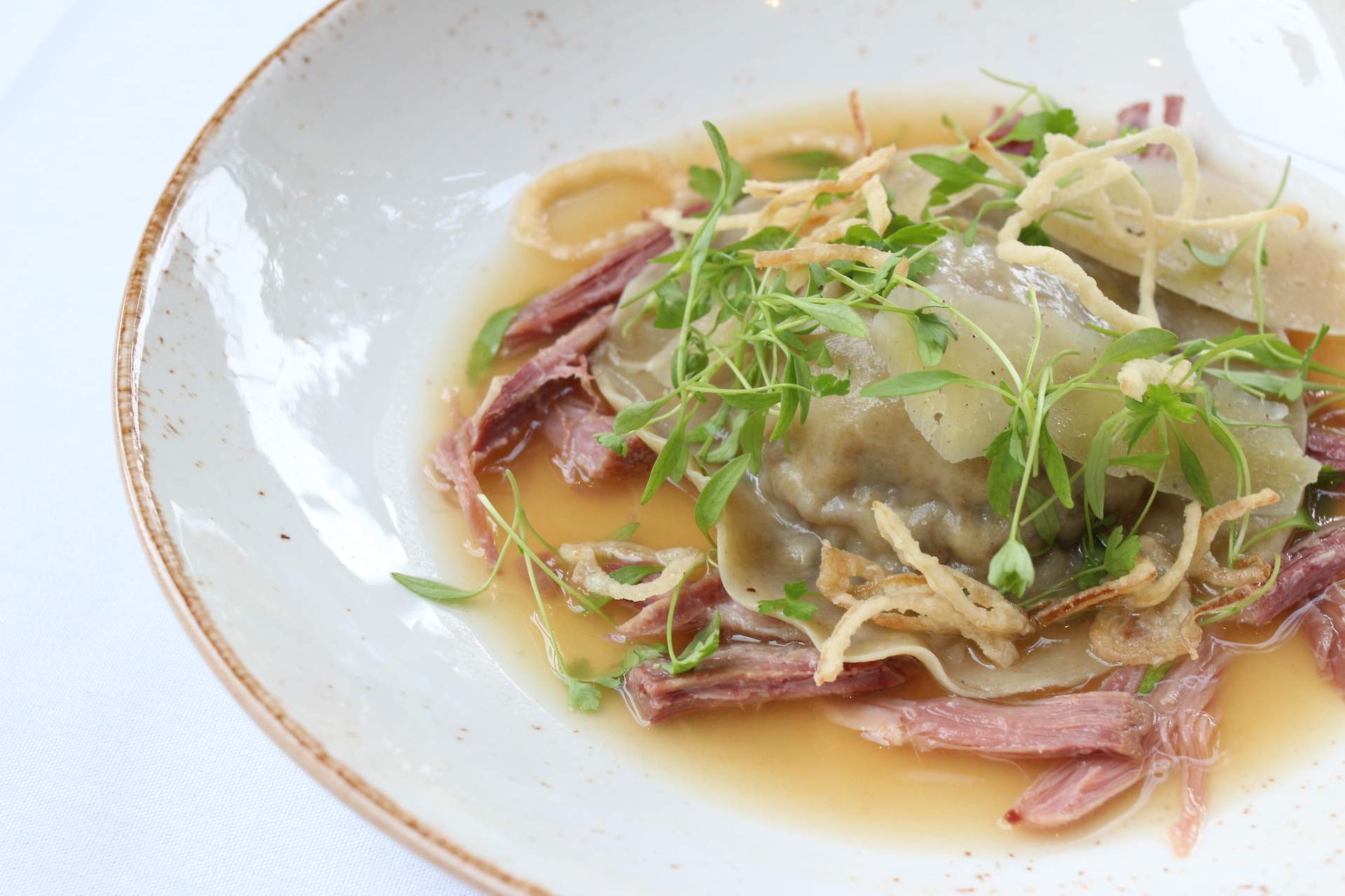 A ham hock raviolo dish at San Francisco restaurant One Market