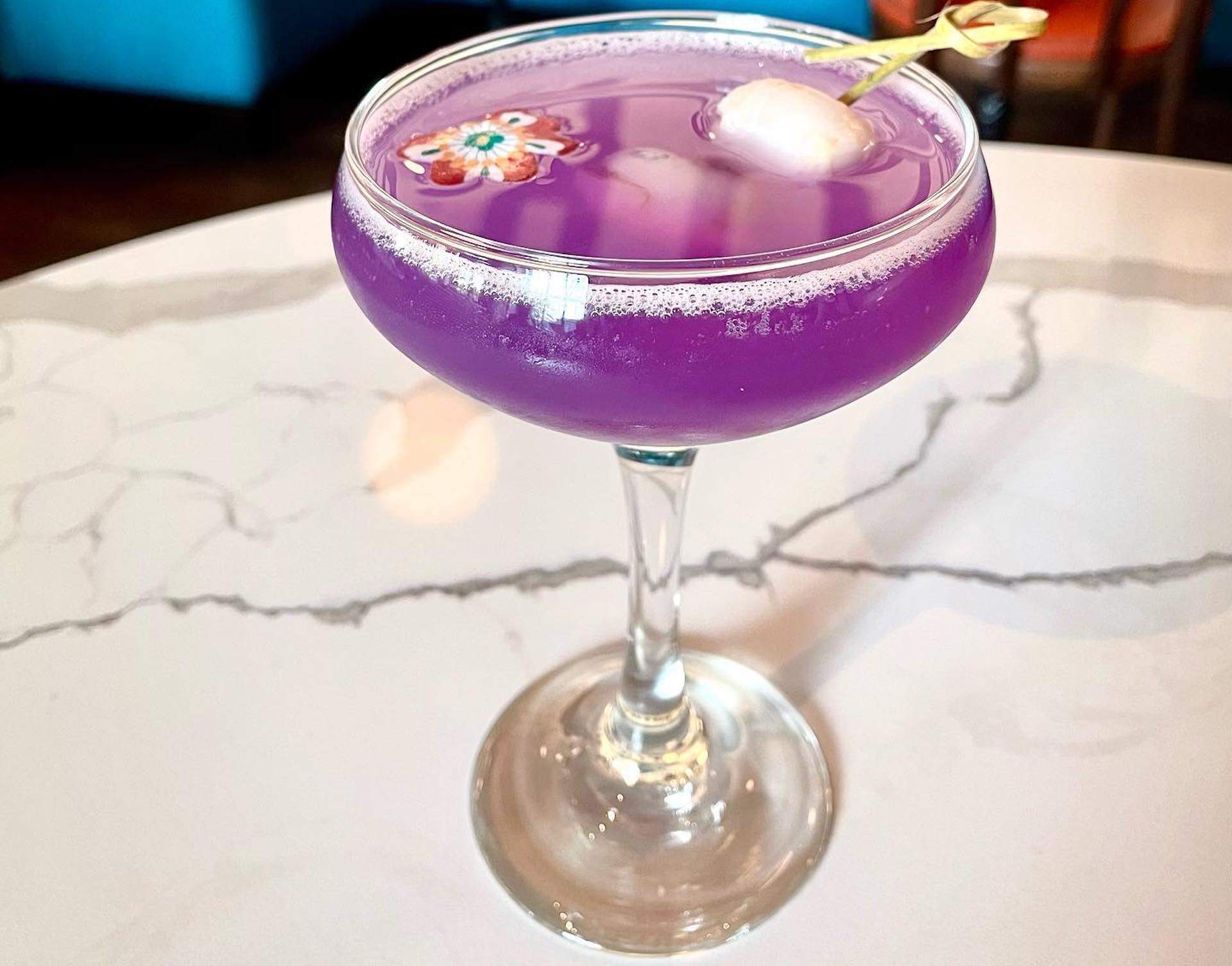 A purple gin cocktail at Cambridge French restaurant Batifol